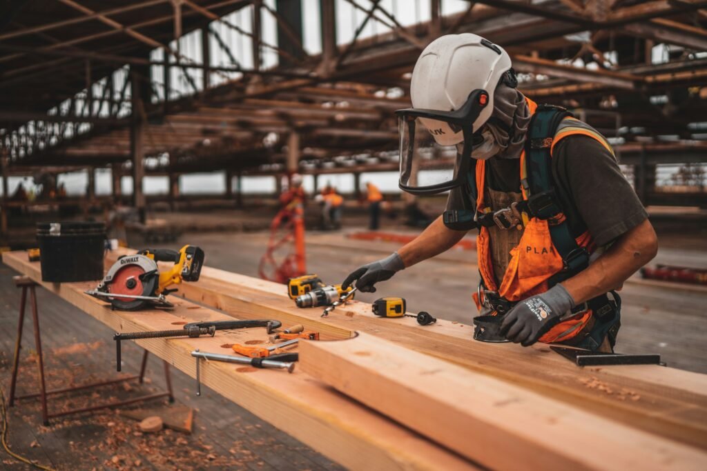 Carpenter using power tools at a workbench, a typical high noise workplace